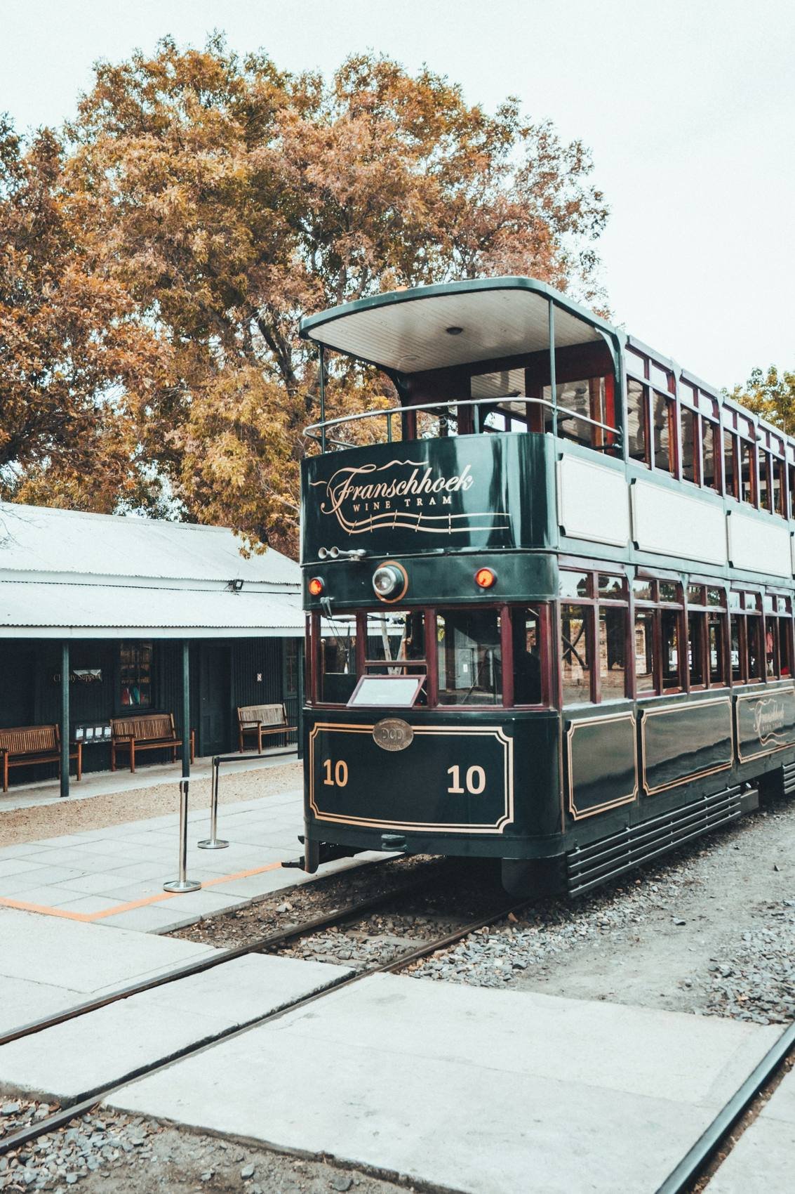 Double-decker Franschhoek Wine Tram at its station